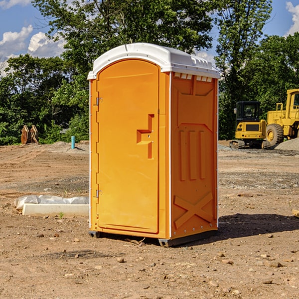 what is the cost difference between standard and deluxe portable restroom rentals in Shoreham Michigan